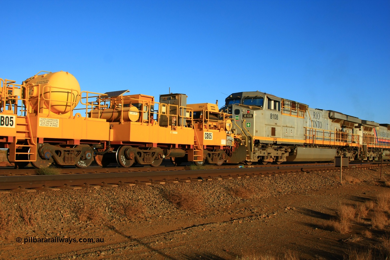 100329 8039
Rio Tinto compressor waggon set CB 05, compressor control waggon with two diesel powered Atlas Copco XAS 97's behind the loco and the receiver waggon with two air tanks or receivers closet to camera. Note the waggons are cut down ore waggons and the wheels are marked 70 kph max. Seen here just outside of 7 Mile. 29th March 2010.
Keywords: CB05;rio-compressor-waggon;