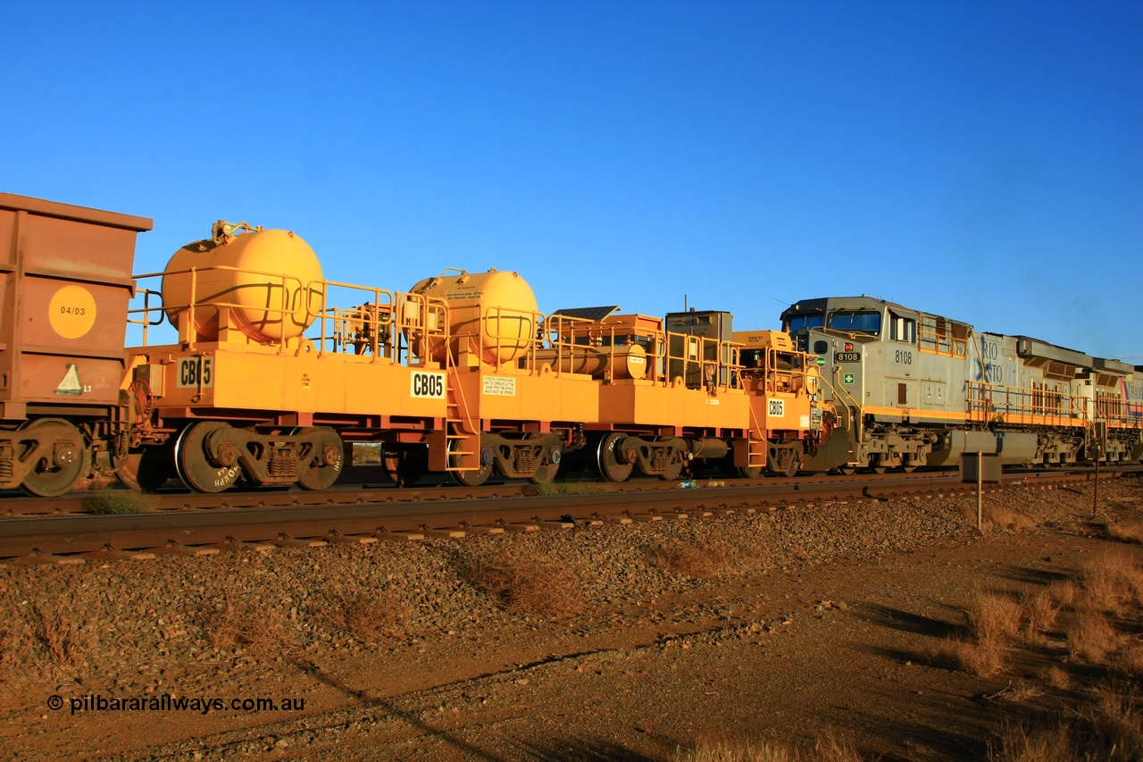 100329 8041
Rio Tinto compressor waggon set CB 05, compressor control waggon with two diesel powered Atlas Copco XAS 97's behind the loco and the receiver waggon with two air tanks or receivers closet to camera. Note the waggons are cut down ore waggons and the wheels are marked 70 kph max. Seen here just outside of 7 Mile. 29th March 2010.
Keywords: CB05;rio-compressor-waggon;