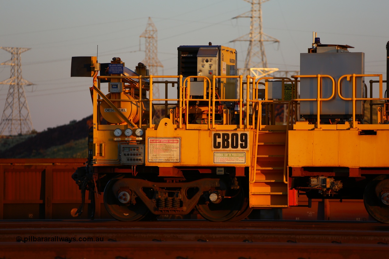 170510 8284
Rio Tinto compressor waggon set CB 09, compressor control waggon with two diesel powered Kaeser M57 Utility air compressors. Note the waggons are modified ore waggon frames. Seen here at Cape Lambert. 10th May 2017.
Keywords: CB09;rio-compressor-waggon;