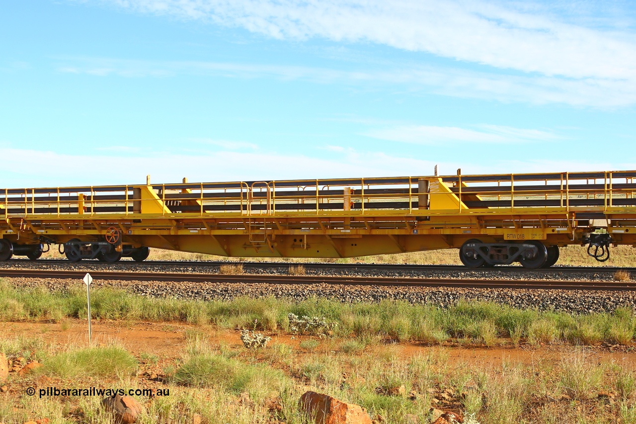 210510 1102
Near Gull on the Rio Tinto Dampier - Tom Price line at the 101.5 km, RTW type intermediate rail waggon RTB 018 on Rio Tinto's Gemco Rail built rail train consist. 10th May 2021. [url=https://goo.gl/maps/9WbRn1E4vP6a1YbN8]Location[/url].
Keywords: RTW-type;RTW018;Gemco-Rail-WA;