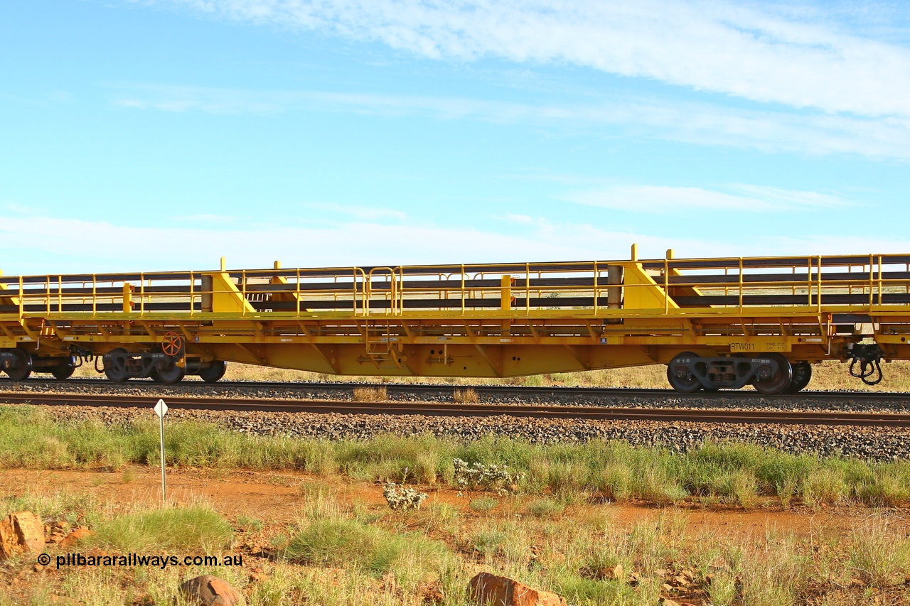 210510 1109
Near Gull on the Rio Tinto Dampier - Tom Price line at the 101.5 km, RTW type intermediate rail waggon RTB 011 on Rio Tinto's Gemco Rail built rail train consist. 10th May 2021. [url=https://goo.gl/maps/9WbRn1E4vP6a1YbN8]Location[/url].
Keywords: RTW-type;RTW011;Gemco-Rail-WA;