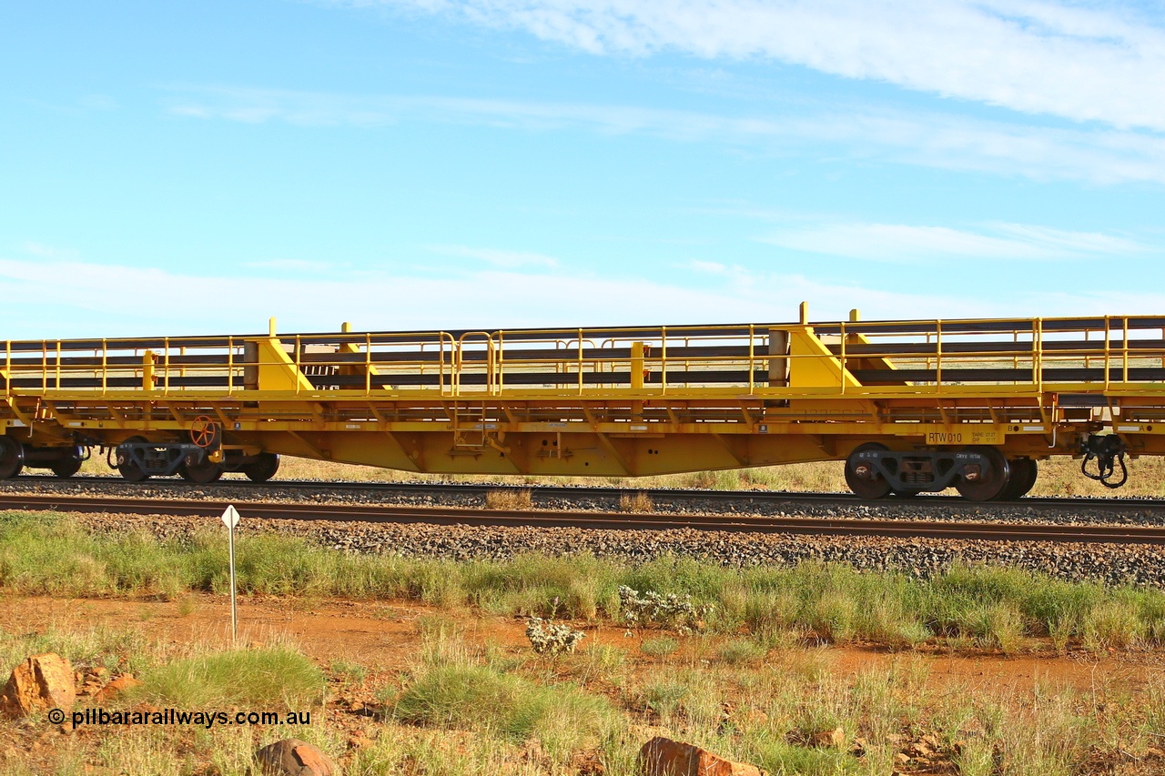 210510 1110
Near Gull on the Rio Tinto Dampier - Tom Price line at the 101.5 km, RTW type intermediate rail waggon RTB 010 on Rio Tinto's Gemco Rail built rail train consist. 10th May 2021. [url=https://goo.gl/maps/9WbRn1E4vP6a1YbN8]Location[/url].
Keywords: RTW-type;RTW010;Gemco-Rail-WA;