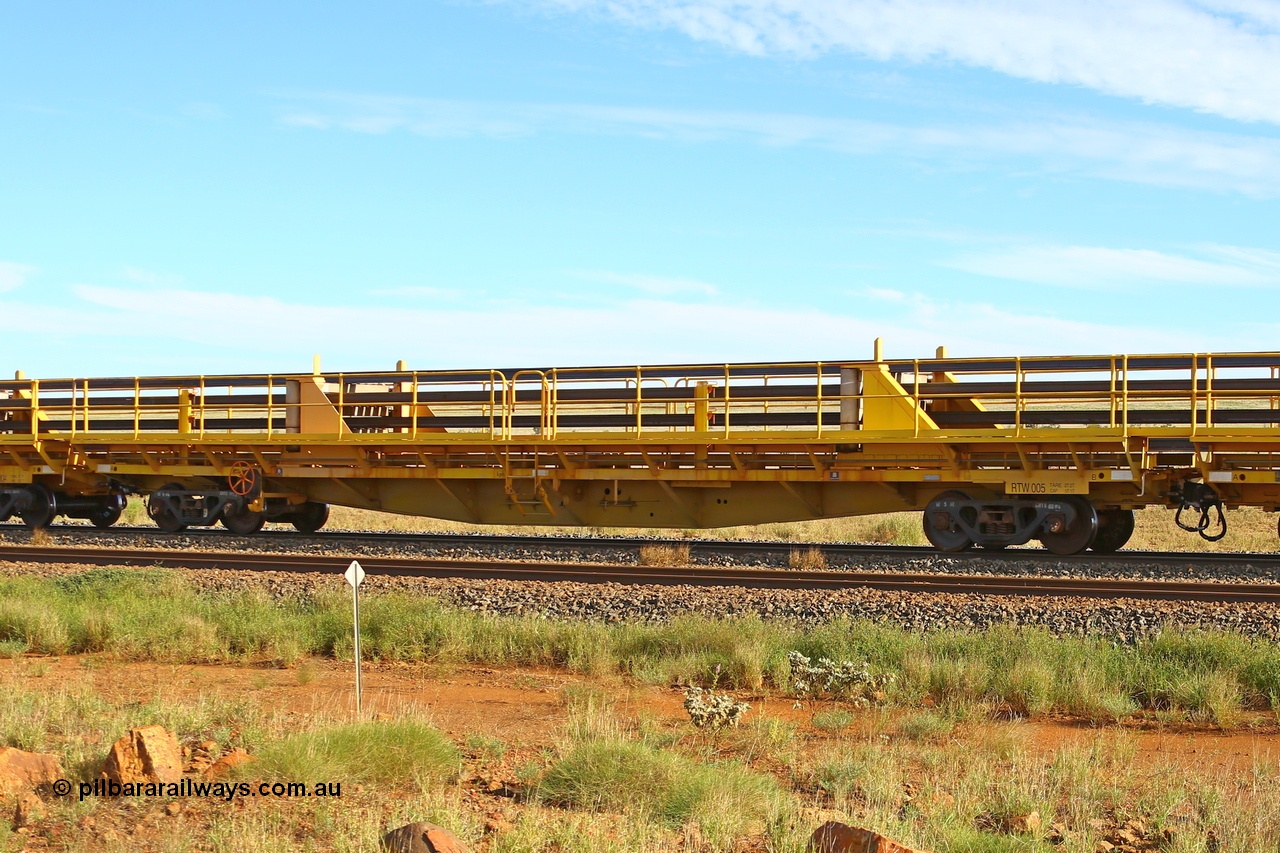 210510 1115
Near Gull on the Rio Tinto Dampier - Tom Price line at the 101.5 km, RTW type intermediate rail waggon RTB 005 on Rio Tinto's Gemco Rail built rail train consist. 10th May 2021. [url=https://goo.gl/maps/9WbRn1E4vP6a1YbN8]Location[/url].
Keywords: RTW-type;RTW005;Gemco-Rail-WA;