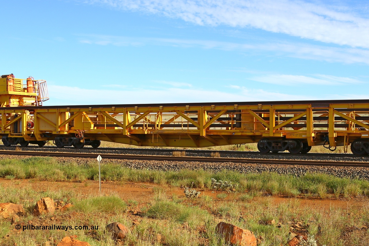 210510 1118
Near Gull on the Rio Tinto Dampier - Tom Price line at the 101.5 km, RTS type straddle crane carrying rail waggon RTS 002 on Rio Tinto's Gemco Rail built rail train consist. 10th May 2021. [url=https://goo.gl/maps/9WbRn1E4vP6a1YbN8]Location[/url].
Keywords: RTS-type;RTS002;Gemco-Rail-WA;