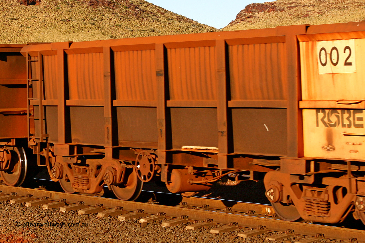 0002 060722 7593
Robe River ore waggon 002, built by Nippon Sharyo Nihon, rotary coupler end handbrake side empty, partial view at the 11.7 km, Cape Lambert. July 22, 2006.
Keywords: 002;Nippon-Sharyo-Nihon;Robe-ore-waggon;