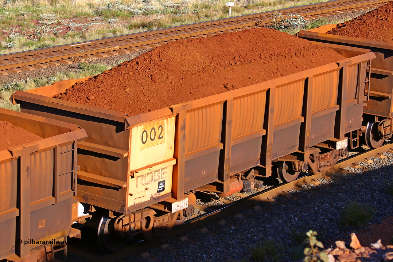 0002 210322 9770
Robe River ore waggon 002, built by Nippon Sharyo Nihon, rotary coupler end non-handbrake side loaded view at the 17 km on the Cape Lambert line, March 22, 2021.
Keywords: 002;Nippon-Sharyo-Nihon;Robe-ore-waggon;