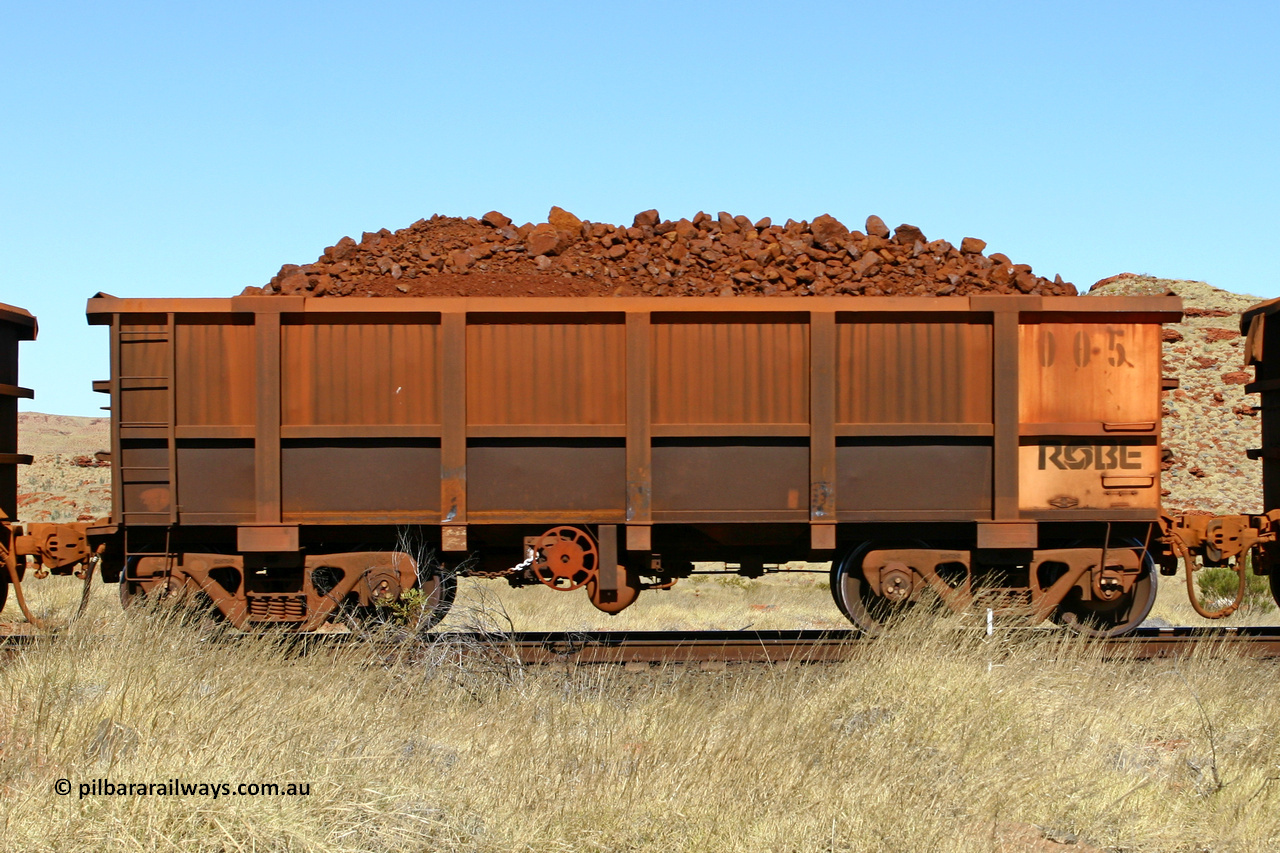 0005 060722 7495
Robe River ore waggon 005, built by Nippon Sharyo Nihon, handbrake side loaded view at the 78.8 km between Western Creek and Maitland on the Deepdale line. July 22, 2006.
Keywords: 005;Nippon-Sharyo-Nihon;Robe-ore-waggon;