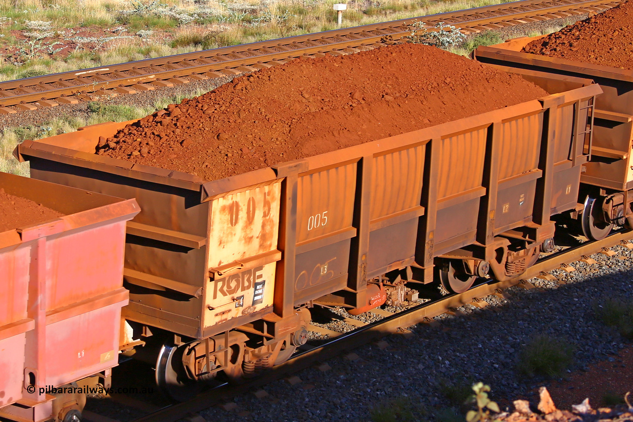 0005 210322 9765
Robe River ore waggon 005, built by Nippon Sharyo Nihon, rotary coupler end non-handbrake side loaded view at the 17 km on the Cape Lambert line, March 22, 2021.
Keywords: 005;Nippon-Sharyo-Nihon;Robe-ore-waggon;