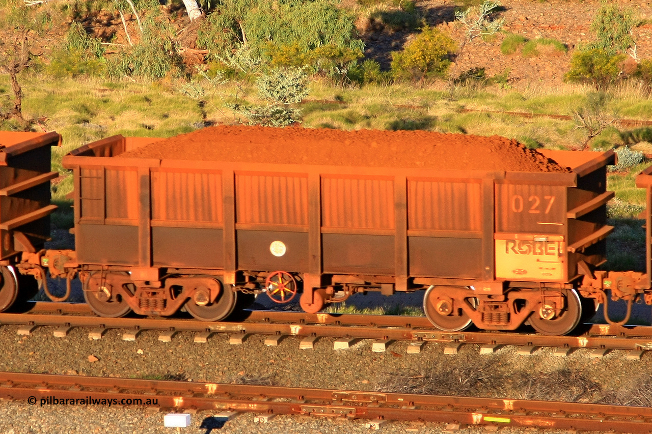 0027 110602 1674
Robe River ore waggon 027, built by Nippon Sharyo Nihon, rotary coupler end handbrake side loaded view at the 71 km, Western Creek on the Deepdale line. June 2, 2011.
Keywords: 027;Nippon-Sharyo-Nihon;Robe-ore-waggon;