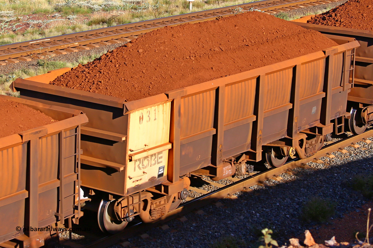 0031 210322 9694
Robe River ore waggon 031, built by Nippon Sharyo Nihon, rotary coupler end non-handbrake side loaded view at the 17 km on the Cape Lambert line, March 22, 2021.
Keywords: 031;Nippon-Sharyo-Nihon;Robe-ore-waggon;