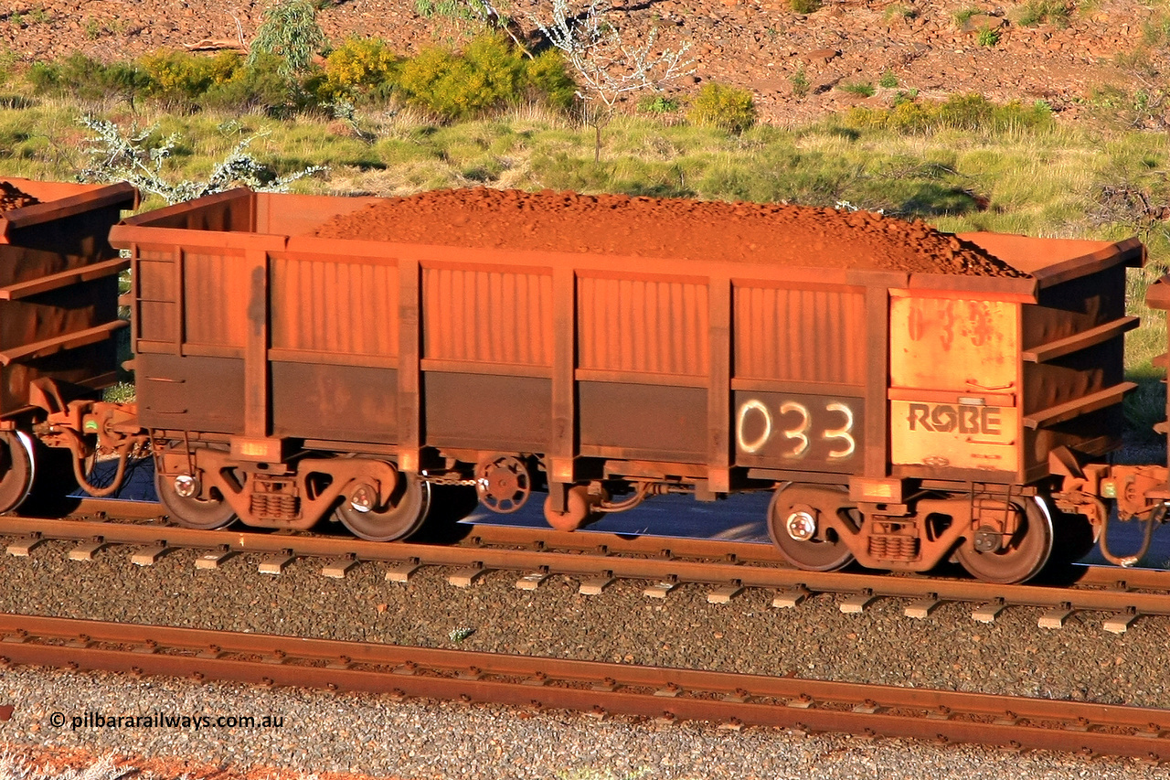 0033 110602 1738
Robe River ore waggon 033, built by Nippon Sharyo Nihon, rotary coupler end handbrake side loaded view at the 71 km, Western Creek on the Deepdale line. June 2, 2011.
Keywords: 033;Nippon-Sharyo-Nihon;Robe-ore-waggon;