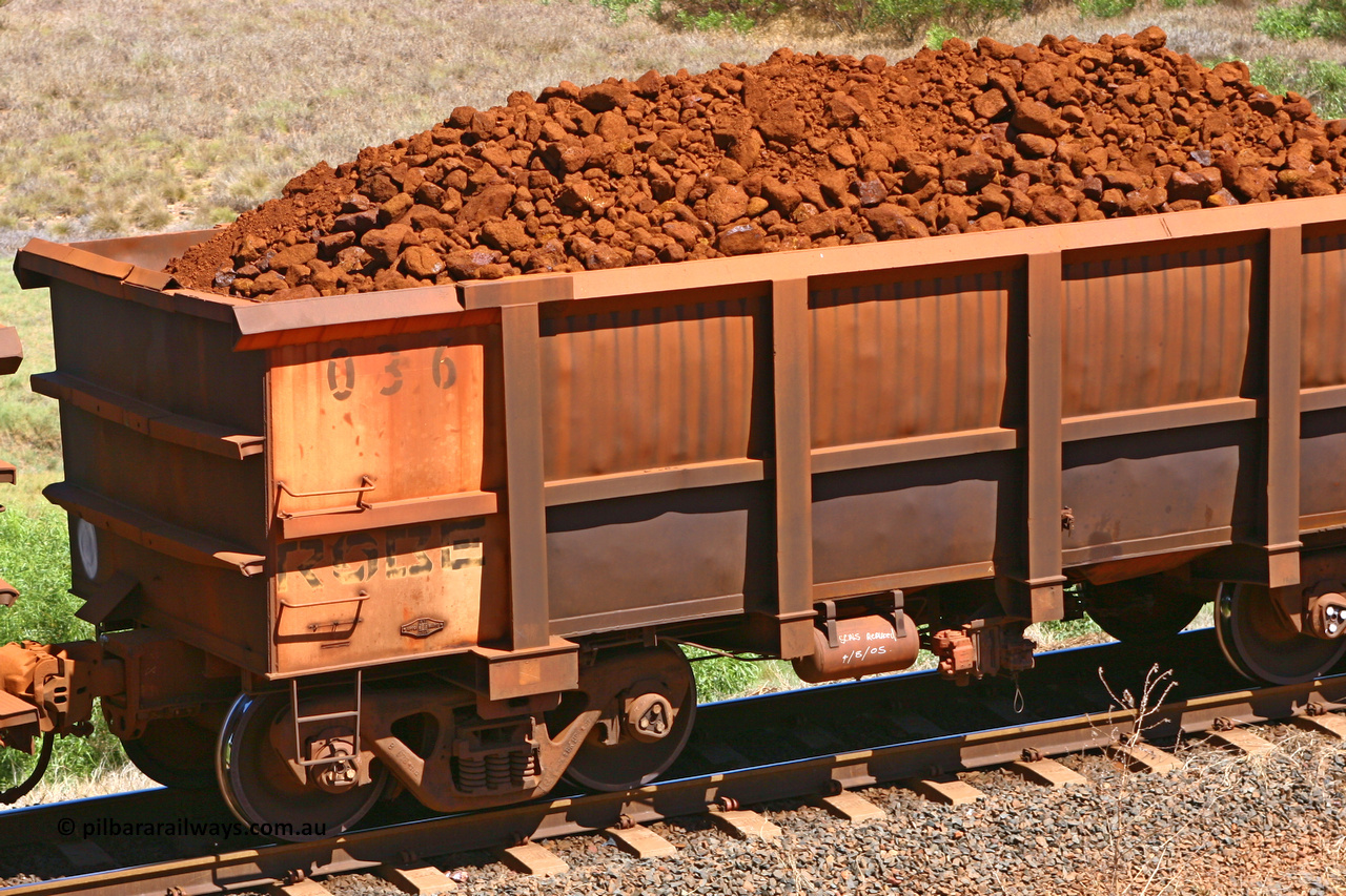0036 061209 8185
Robe River ore waggon 036, built by Nippon Sharyo Nihon, rotary coupler end non-handbrake side loaded view at the 7 km location just south of Cape Lambert yard. December 9, 2006.
Keywords: 036;Nippon-Sharyo-Nihon;Robe-ore-waggon;
