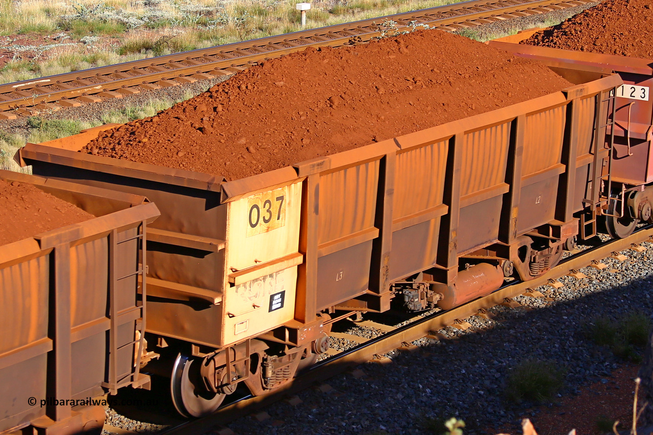 0037 210322 9704
Robe River ore waggon 037, built by Nippon Sharyo Nihon, rotary coupler end non-handbrake side loaded view at the 17 km on the Cape Lambert line, March 22, 2021.
Keywords: 037;Nippon-Sharyo-Nihon;Robe-ore-waggon;
