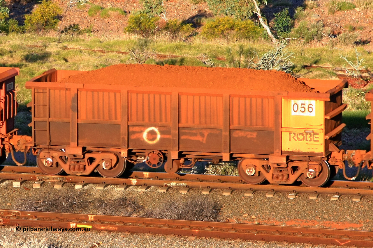 0056 110602 1663
Robe River ore waggon 056, built by Nippon Sharyo Nihon, rotary coupler end handbrake side loaded view at the 71 km, Western Creek on the Deepdale line. June 2, 2011.
Keywords: 056;Nippon-Sharyo-Nihon;Robe-ore-waggon;