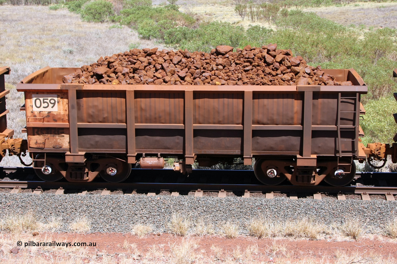 0059 081209 0115
Robe River ore waggon 059, built by Nippon Sharyo Nihon, non-handbrake side loaded view at the 7 km location just south of Cape Lambert yard. December 9, 2008.
Keywords: 059;Nippon-Sharyo-Nihon;Robe-ore-waggon;