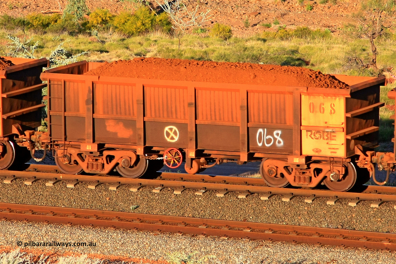 0068 110602 1740
Robe River ore waggon 068, built by Nippon Sharyo Nihon, rotary coupler end handbrake side loaded view at the 71 km, Western Creek on the Deepdale line. June 2, 2011.
Keywords: 068;Nippon-Sharyo-Nihon;Robe-ore-waggon;
