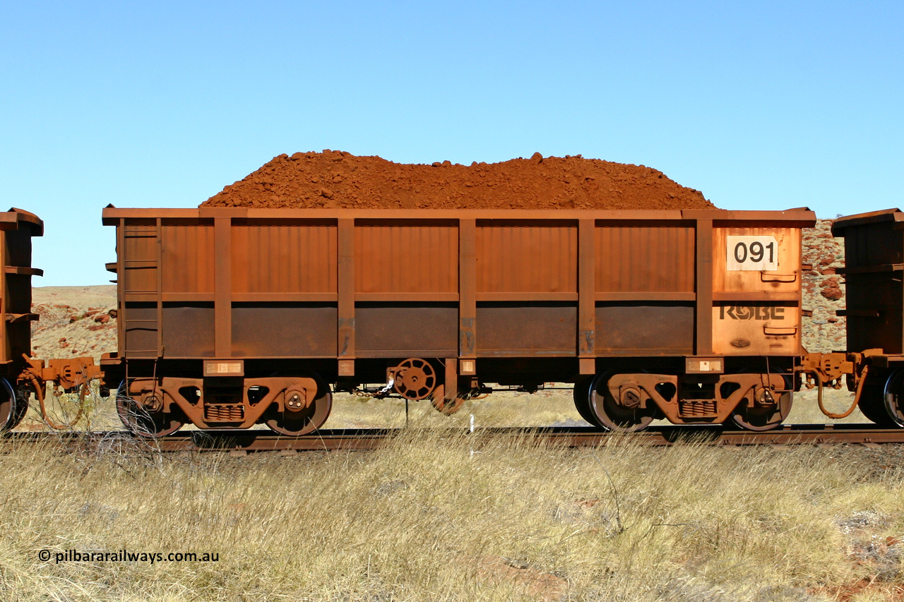 0091 060722 7485
Robe River ore waggon 091, built by Nippon Sharyo Nihon, handbrake side loaded view at the 78.8 km between Western Creek and Maitland on the Deepdale line. July 22, 2006.
Keywords: 091;Nippon-Sharyo-Nihon;Robe-ore-waggon;