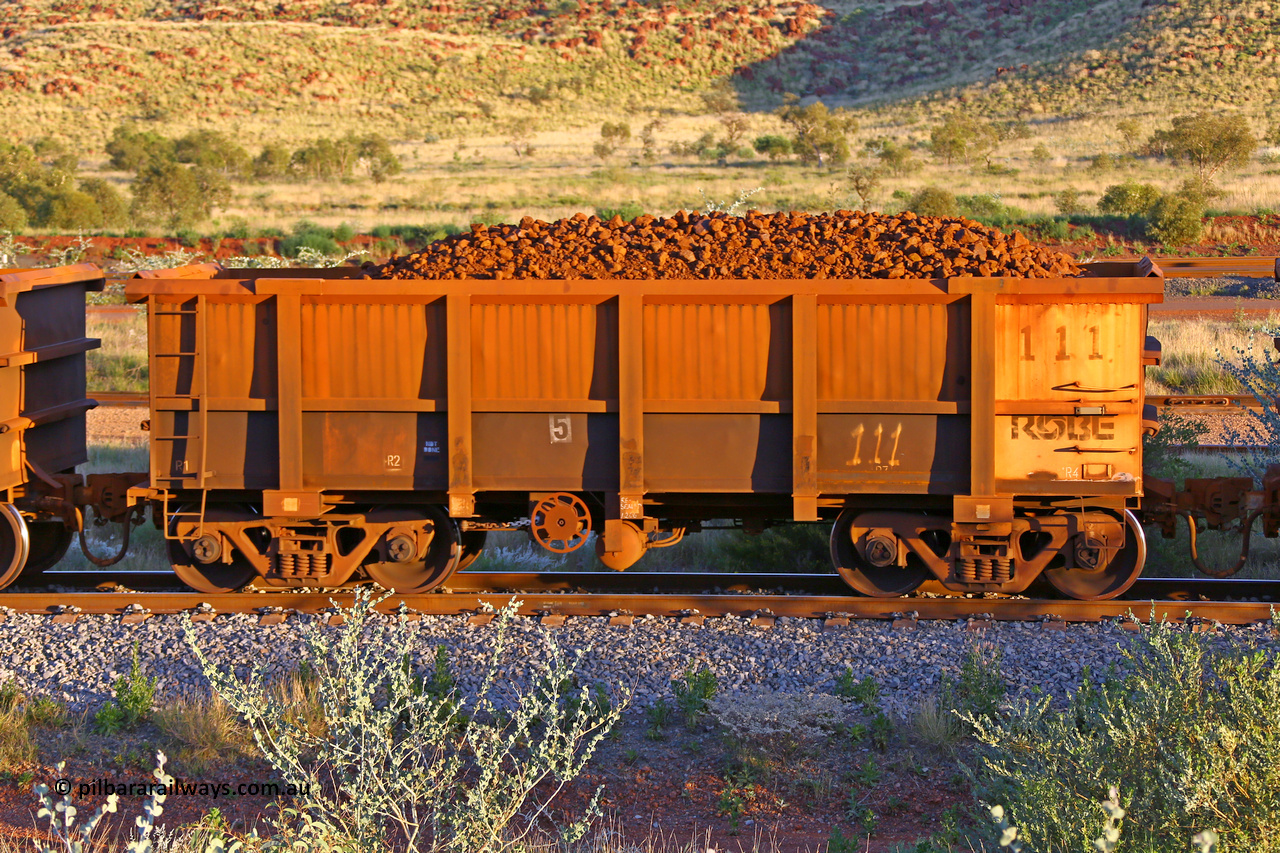 0111 170513 8733
Robe River ore waggon 111, built by Nippon Sharyo Nihon, handbrake side loaded view, Cape Lambert yard, May 13, 2017.
Keywords: 111;Nippon-Sharyo-Nihon;Robe-ore-waggon;