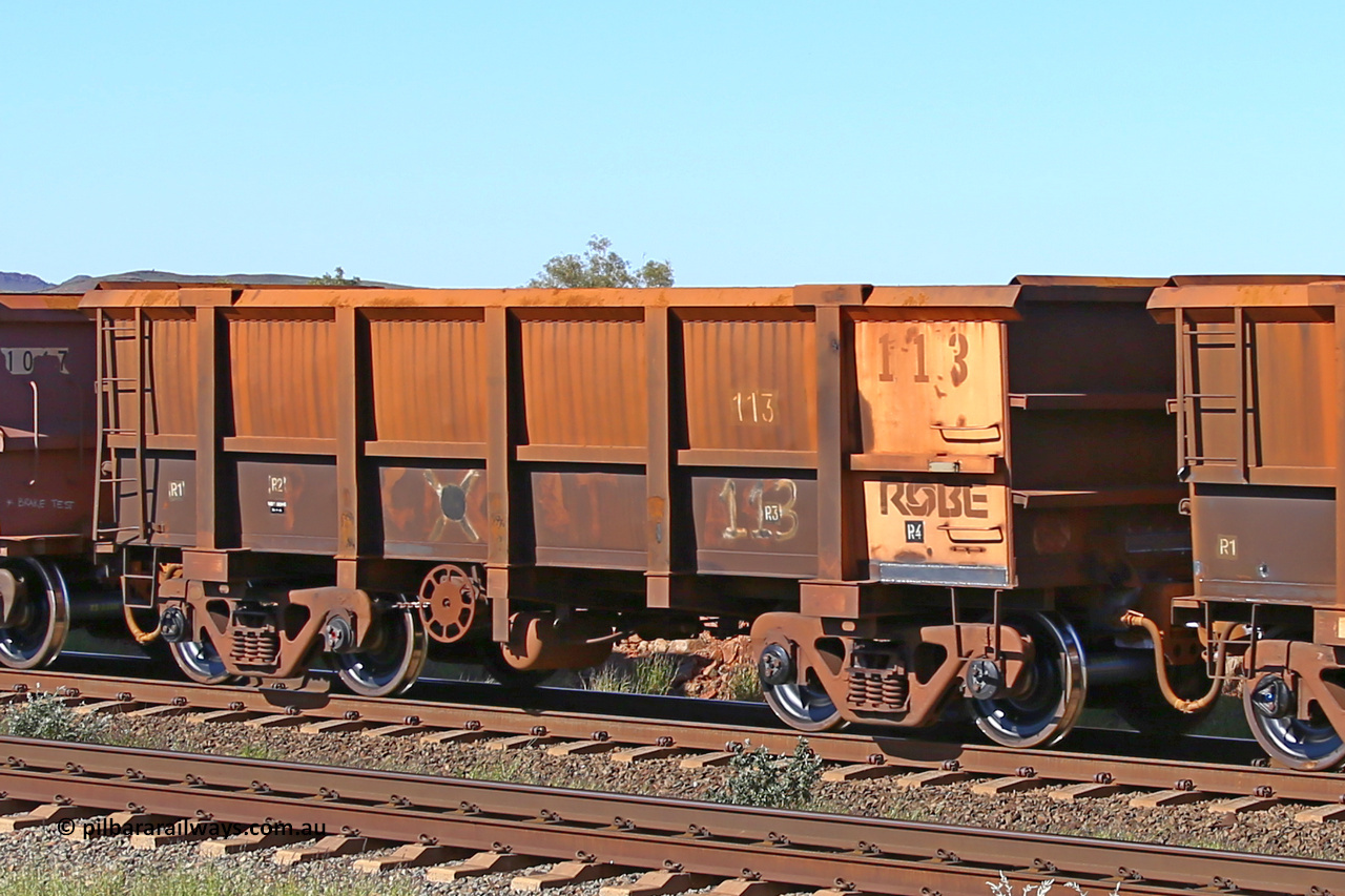 0113 160727 0990
Robe River ore waggon 113, built by Nippon Sharyo Nihon, rotary coupler end handbrake side empty view at Harding Siding on the Cape Lambert line, July 27, 2016.
Keywords: 113;Nippon-Sharyo-Nihon;Robe-ore-waggon;