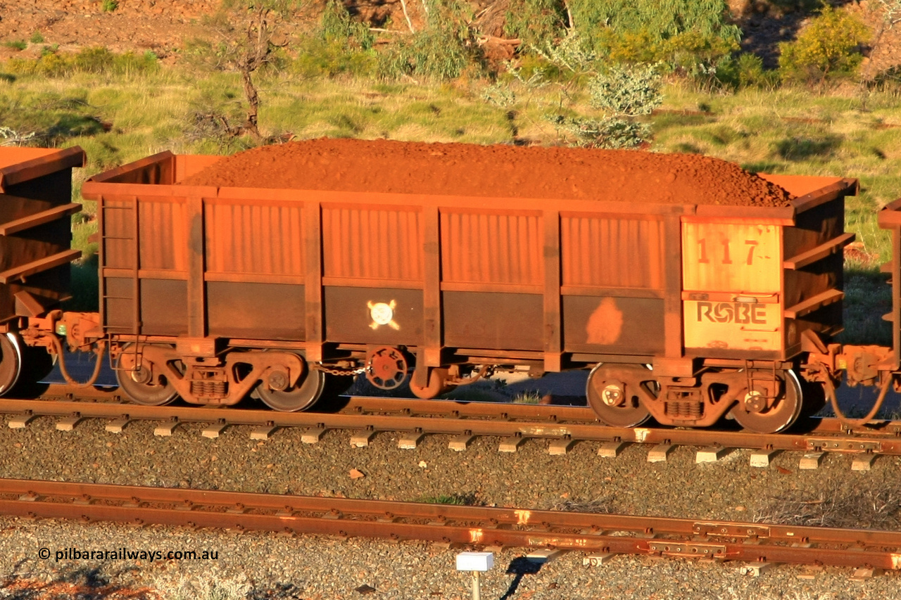 0117 110602 1637
Robe River ore waggon 117, built by Nippon Sharyo Nihon, rotary coupler end handbrake side loaded view at the 71 km, Western Creek on the Deepdale line. June 2, 2011.
Keywords: 117;Nippon-Sharyo-Nihon;Robe-ore-waggon;
