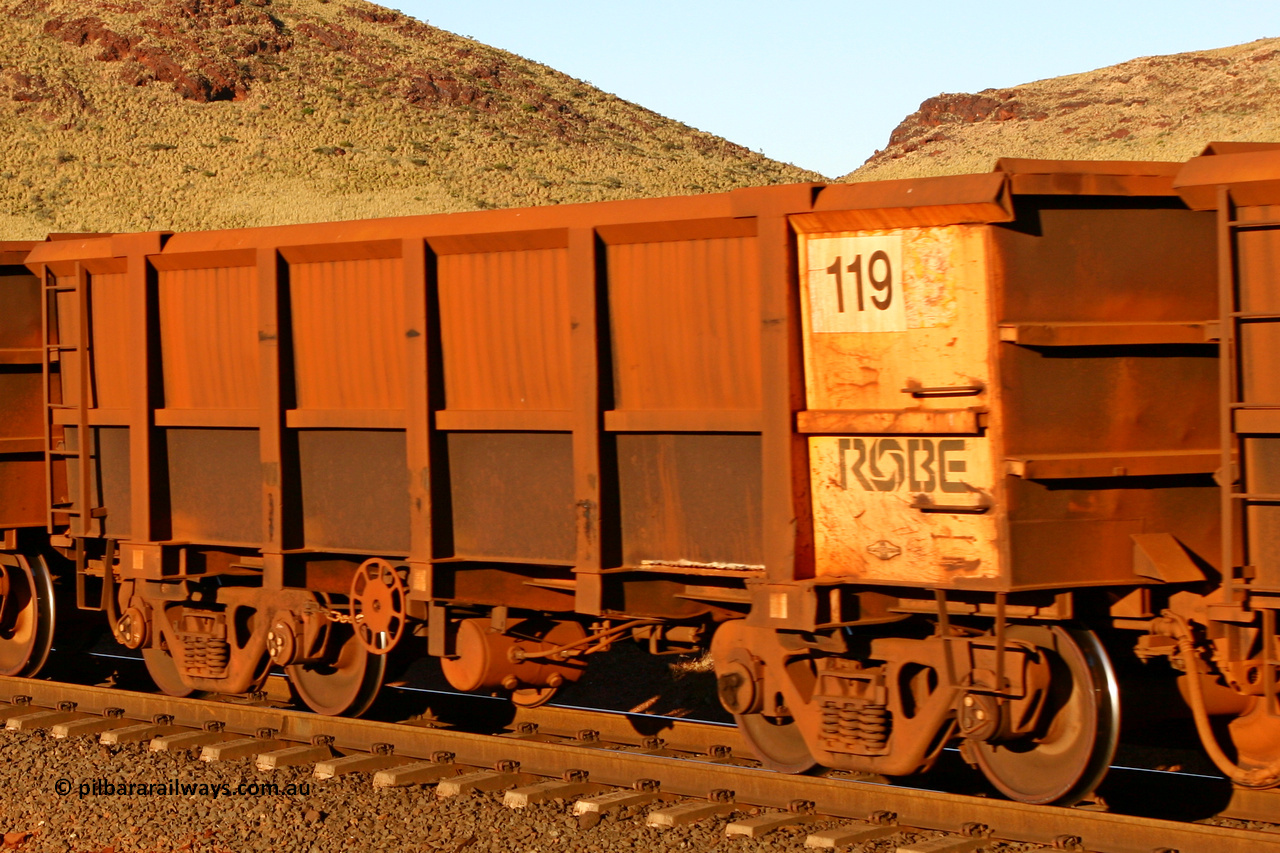 0119 060722 7591
Robe River ore waggon 119, built by Nippon Sharyo Nihon, rotary coupler end handbrake side empty view at the 11.7 km, Cape Lambert. July 22, 2006.
Keywords: 119;Nippon-Sharyo-Nihon;Robe-ore-waggon;