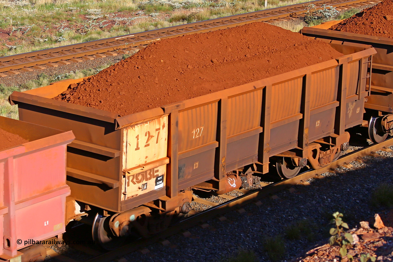0127 210322 9686
Robe River ore waggon 127, built by Nippon Sharyo Nihon, rotary coupler end non-handbrake side loaded view at the 17 km on the Cape Lambert line, March 22, 2021.
Keywords: 127;Nippon-Sharyo-Nihon;Robe-ore-waggon;