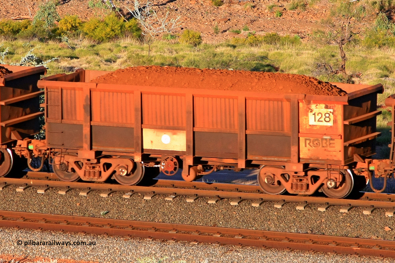 0128 110602 1720
Robe River ore waggon 128, built by Nippon Sharyo Nihon, rotary coupler end handbrake side loaded view at the 71 km, Western Creek on the Deepdale line. June 2, 2011.
Keywords: 128;Nippon-Sharyo-Nihon;Robe-ore-waggon;
