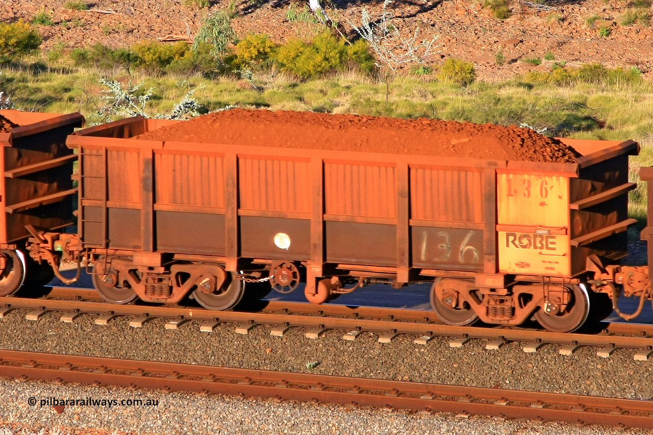 0136 110602 1701
Robe River ore waggon 136, built by Nippon Sharyo Nihon, rotary coupler end handbrake side loaded view at the 71 km, Western Creek on the Deepdale line. June 2, 2011.
Keywords: 136;Nippon-Sharyo-Nihon;Robe-ore-waggon;