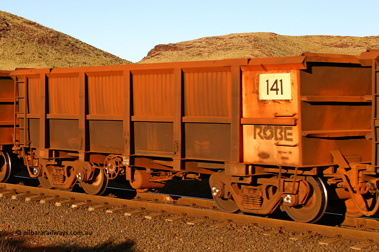 0141 060722 7617
Robe River ore waggon 141, built by Nippon Sharyo Nihon, rotary coupler end handbrake side empty view, at the 11.7 km, Cape Lambert. July 22, 2006.
Keywords: 141;Nippon-Sharyo-Nihon;Robe-ore-waggon;