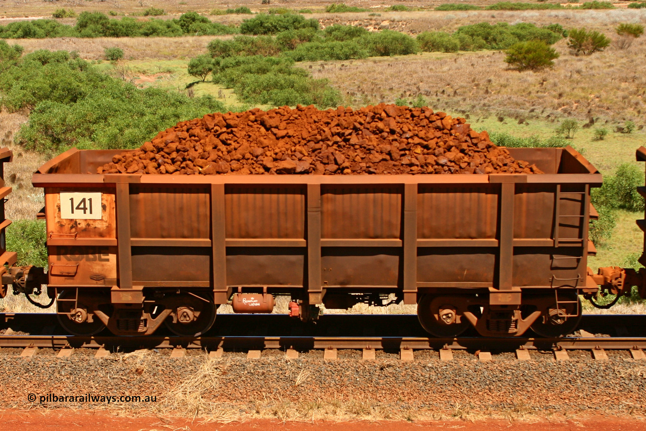 0141 061209 8188
Robe River ore waggon 141, built by Nippon Sharyo Nihon, non-handbrake side loaded view at the 7 km location just south of Cape Lambert yard. December 9, 2006.
Keywords: 141;Nippon-Sharyo-Nihon;Robe-ore-waggon;