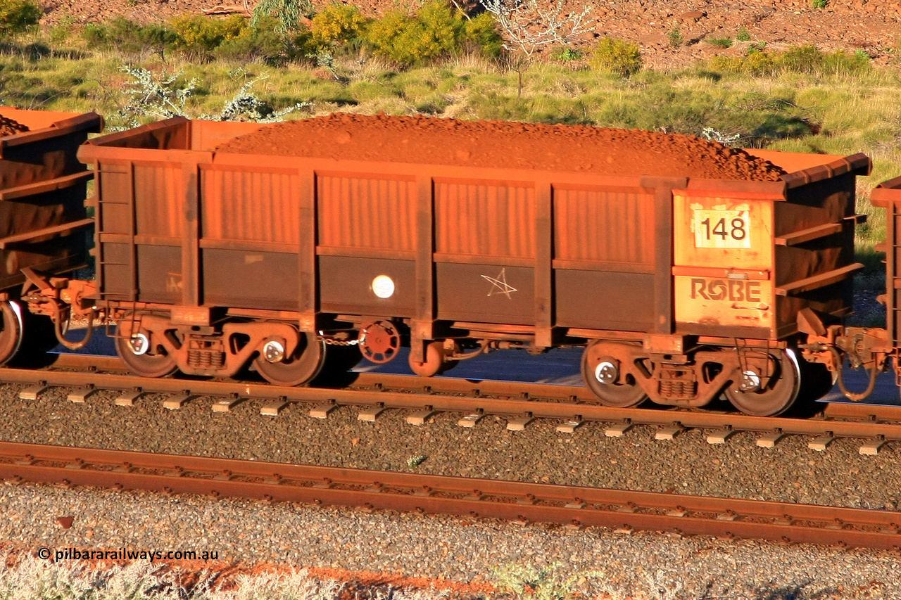 0148 110602 1745
Robe River ore waggon 148, built by Nippon Sharyo Nihon, rotary coupler end handbrake side loaded view at the 71 km, Western Creek on the Deepdale line. June 2, 2011.
Keywords: 148;Nippon-Sharyo-Nihon;Robe-ore-waggon;