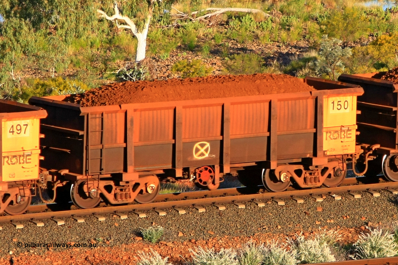 0150 110602 1597
Robe River ore waggon 150, built by Nippon Sharyo Nihon, fixed coupler handbrake side loaded view at the 71 km, Western Creek on the Deepdale line. June 2, 2011.
Keywords: 150;Nippon-Sharyo-Nihon;Robe-ore-waggon;