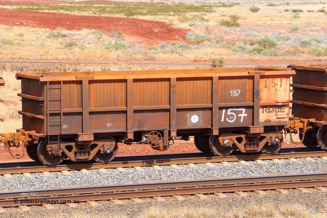 0157 141124 6838
Robe River ore waggon 157, built by Nippon Sharyo Nihon, fixed coupler handbrake side empty view at the 25 km at Arches Siding on the Cape Lambert line. November 24, 2014.
Keywords: 157;Nippon-Sharyo-Nihon;Robe-ore-waggon;