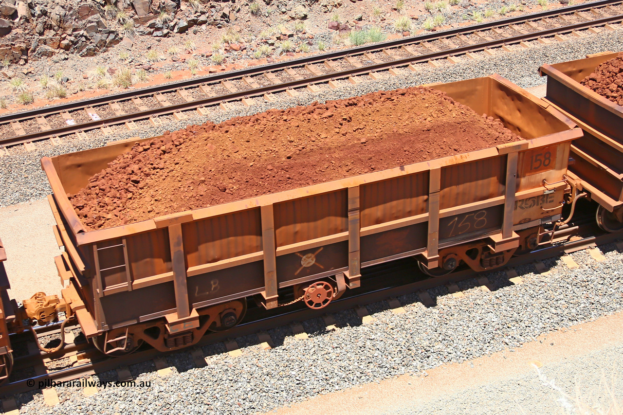 0158 160306 1470
Robe River ore waggon 158, built by Nippon Sharyo Nihon, fixed coupler handbrake side loaded view at the 45 km, Harding Siding on the Cape Lambert line. March 6, 2016.
Keywords: 158;Nippon-Sharyo-Nihon;Robe-ore-waggon;