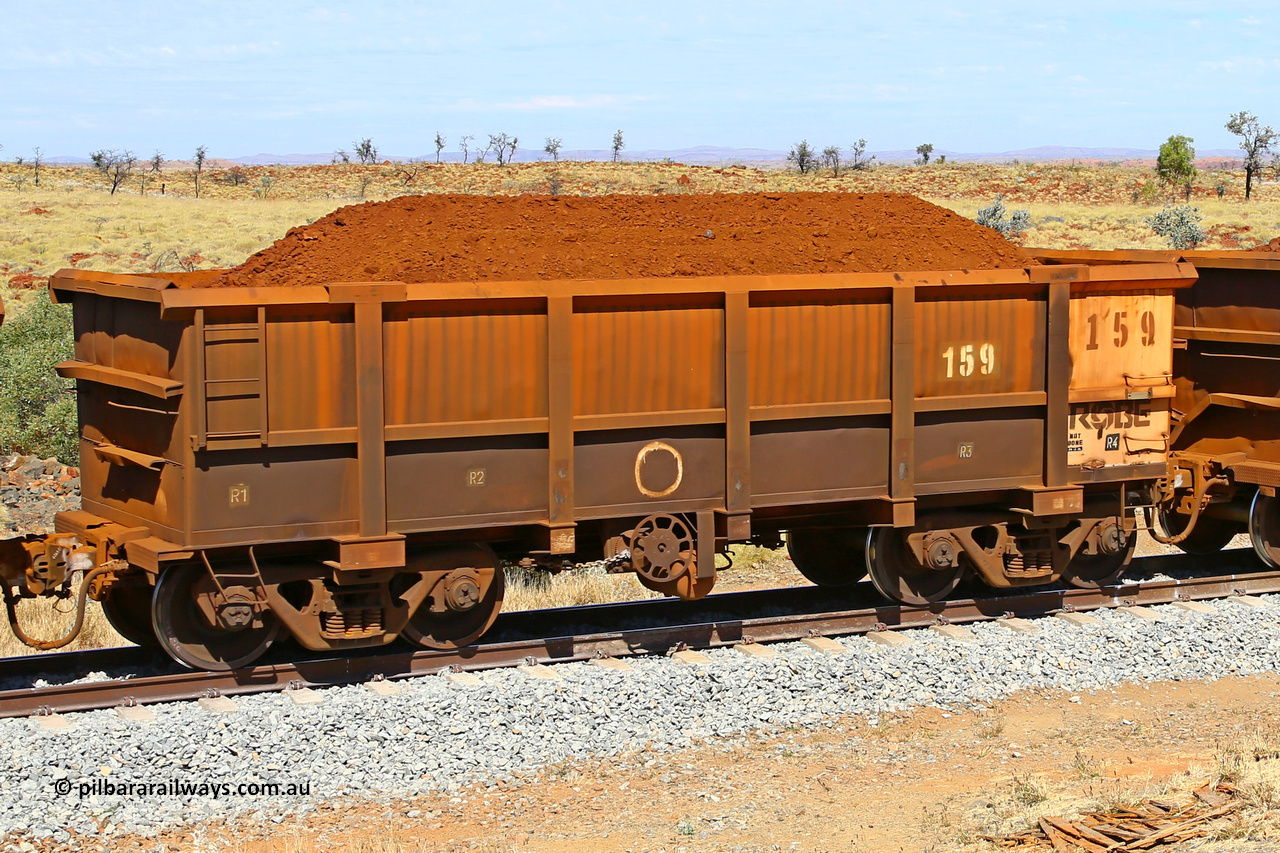 0159 170729 0228
Robe River ore waggon 159, built by Nippon Sharyo Nihon, fixed coupler handbrake side loaded view at the 103 km, between Maitland Siding and the Fortescue River on the Deepdale line. July 29, 2017.
Keywords: 159;Nippon-Sharyo-Nihon;Robe-ore-waggon;