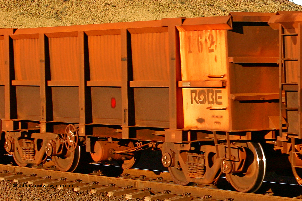 0162 060722 7625
Robe River ore waggon 162, built by Nippon Sharyo Nihon, rotary coupler end handbrake side empty view, at the 11.7 km, Cape Lambert. July 22, 2006.
Keywords: 162;Nippon-Sharyo-Nihon;Robe-ore-waggon;