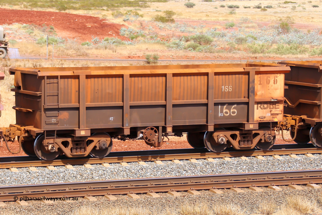 0166 141124 6823
Robe River ore waggon 166, built by Nippon Sharyo Nihon, fixed coupler handbrake side empty view at the 25 km at Arches Siding on the Cape Lambert line. November 24, 2014.
Keywords: 166;Nippon-Sharyo-Nihon;Robe-ore-waggon;
