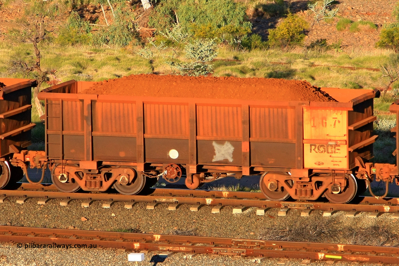 0167 110602 1676
Robe River ore waggon 167, built by Nippon Sharyo Nihon, rotary coupler end handbrake side loaded view at the 71 km, Western Creek on the Deepdale line. June 2, 2011.
Keywords: 167;Nippon-Sharyo-Nihon;Robe-ore-waggon;