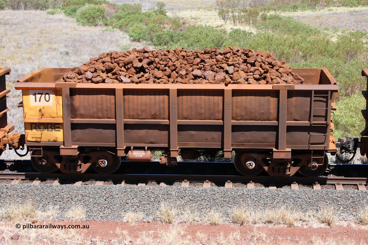 0170 081209 0114
Robe River ore waggon 170, built by Nippon Sharyo Nihon, non-handbrake side loaded view at the 7 km location just south of Cape Lambert yard. December 9, 2008.
Keywords: 170;Nippon-Sharyo-Nihon;Robe-ore-waggon;