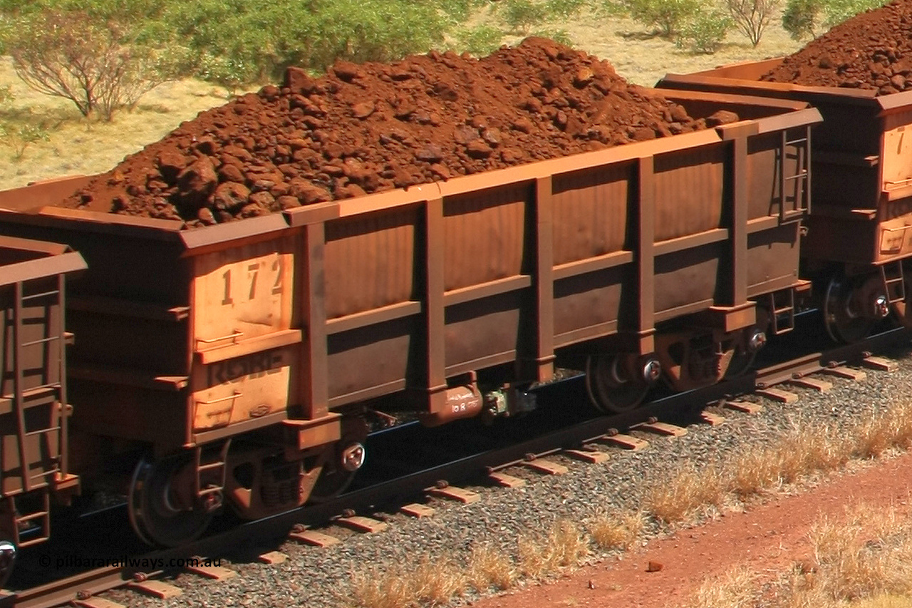 0172 081209 0109
Robe River ore waggon 172, built by Nippon Sharyo Nihon, rotary coupler end non-handbrake side loaded view at the 7 km location just south of Cape Lambert yard. December 9, 2008.
Keywords: 172;Nippon-Sharyo-Nihon;Robe-ore-waggon;
