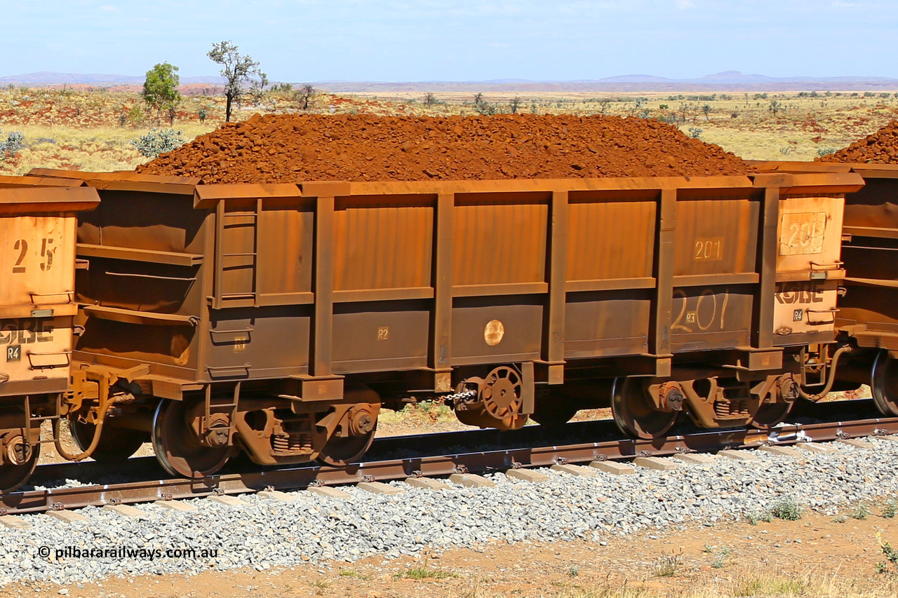 0201 170729 0206
Robe River ore waggon 201, built by Nippon Sharyo Nihon, fixed coupler handbrake side loaded view at the 103 km, between Maitland Siding and the Fortescue River on the Deepdale line. July 29, 2017.
Keywords: 201;Nippon-Sharyo-Nihon;Robe-ore-waggon;