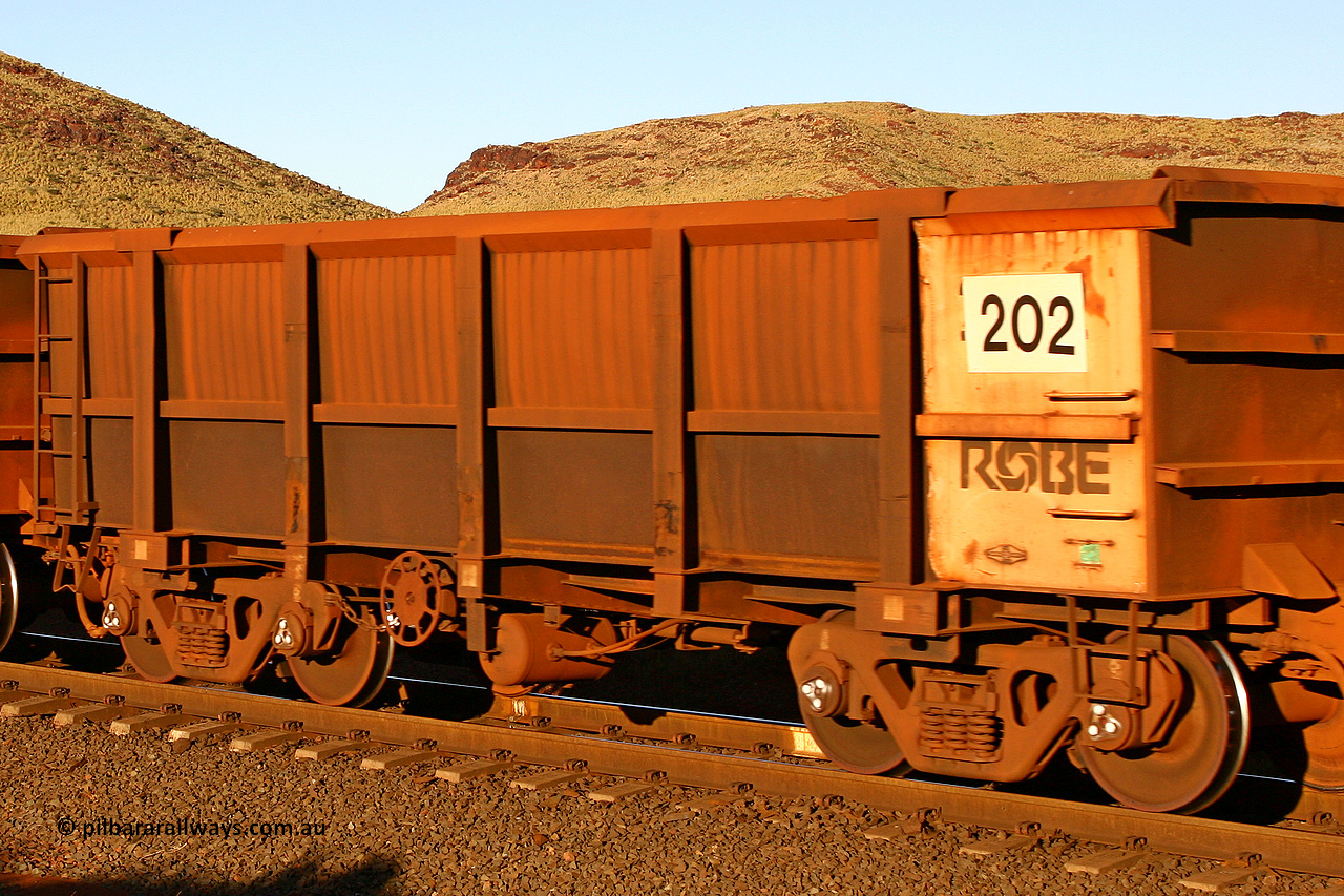 0202 060722 7620
Robe River ore waggon 202, built by Nippon Sharyo Nihon, rotary coupler end handbrake side empty view, at the 11.7 km, Cape Lambert. July 22, 2006.
Keywords: 202;Nippon-Sharyo-Nihon;Robe-ore-waggon;