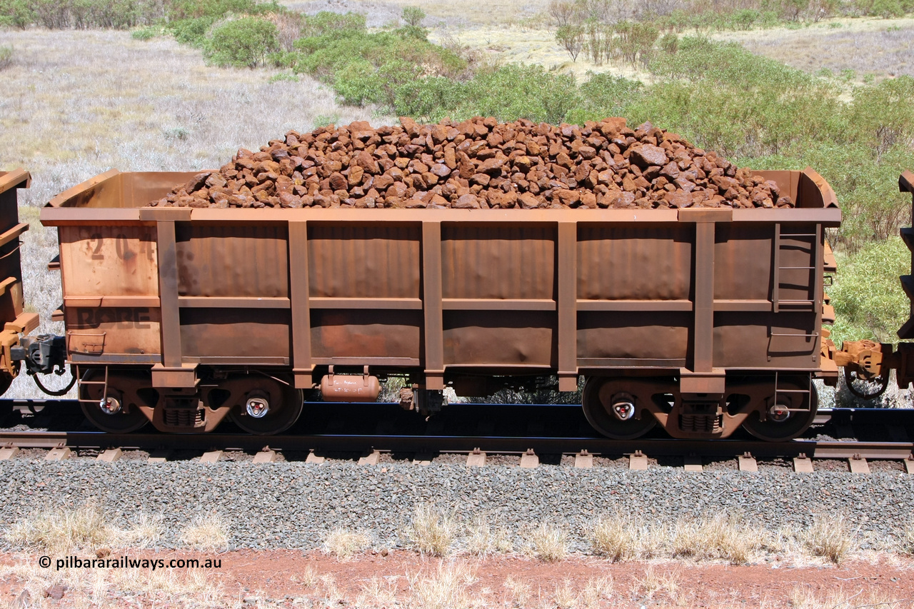 0204 081209 0113
Robe River ore waggon 190, built by Nippon Sharyo Nihon, non-handbrake side loaded view at the 7 km location just south of Cape Lambert yard. December 9, 2008.
Keywords: 204;Nippon-Sharyo-Nihon;Robe-ore-waggon;