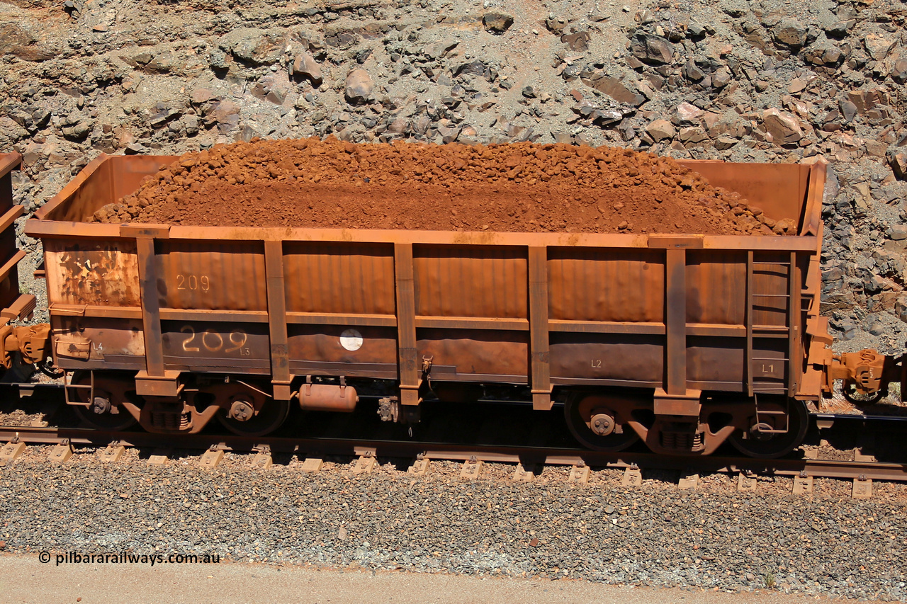 0209 160306 1603
Robe River ore waggon 209, built by Nippon Sharyo Nihon, fixed coupler non-handbrake side loaded view at the 45 km, Harding Siding on the Cape Lambert line. March 6, 2016.
Keywords: 209;Nippon-Sharyo-Nihon;Robe-ore-waggon;