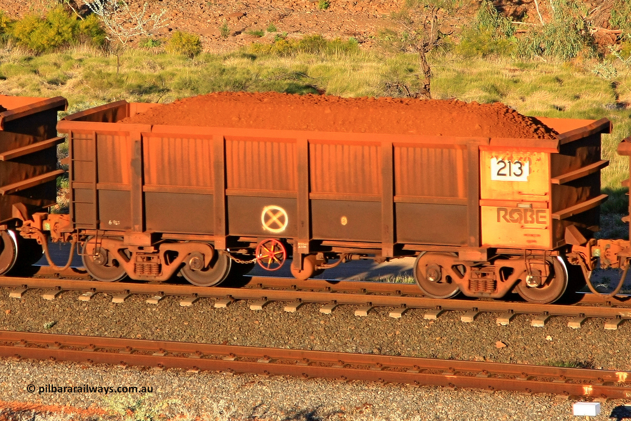 0213 110602 1681
Robe River ore waggon 213, built by Nippon Sharyo Nihon, rotary coupler end handbrake side loaded view at the 71 km, Western Creek on the Deepdale line. June 2, 2011.
Keywords: 213;Nippon-Sharyo-Nihon;Robe-ore-waggon;