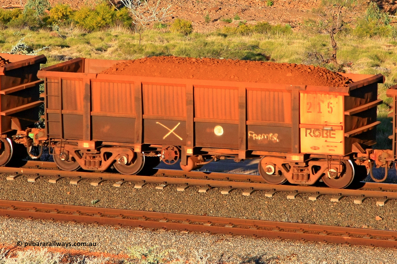 0215 110602 1733
Robe River ore waggon 215, built by Nippon Sharyo Nihon, rotary coupler end handbrake side loaded view at the 71 km, Western Creek on the Deepdale line. June 2, 2011.
Keywords: 215;Nippon-Sharyo-Nihon;Robe-ore-waggon;