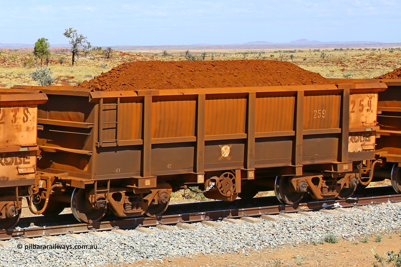 0259 170729 0252
Robe River ore waggon 259, built by Nippon Sharyo Nihon, fixed coupler handbrake side loaded view at the 103 km, between Maitland Siding and the Fortescue River on the Deepdale line. July 29, 2017.
Keywords: 259;Nippon-Sharyo-Nihon;Robe-ore-waggon;