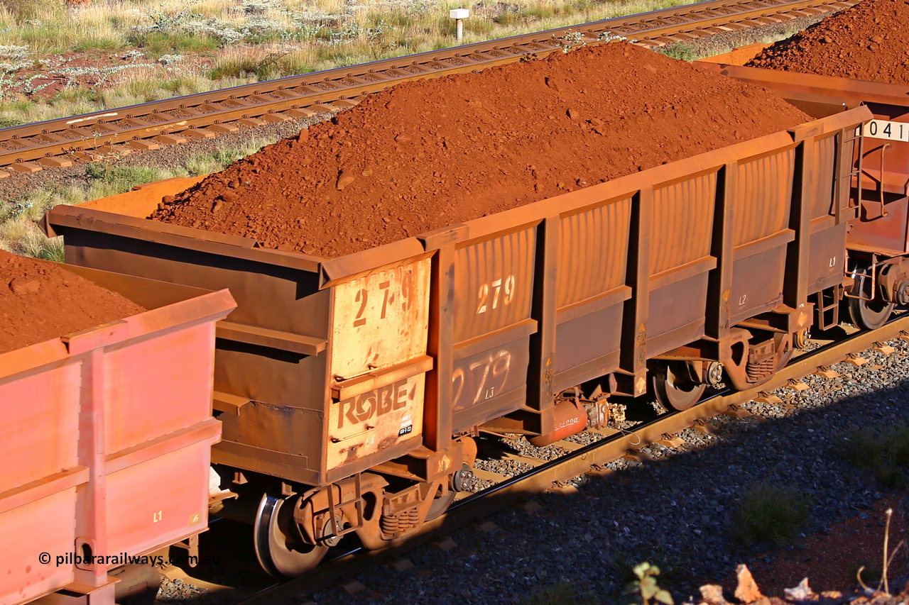 0279 210322 9699
Robe River ore waggon 279, built by Nippon Sharyo Nihon, rotary coupler end non-handbrake side loaded view at the 17 km on the Cape Lambert line, March 22, 2021.
Keywords: 279;Nippon-Sharyo-Nihon;Robe-ore-waggon;