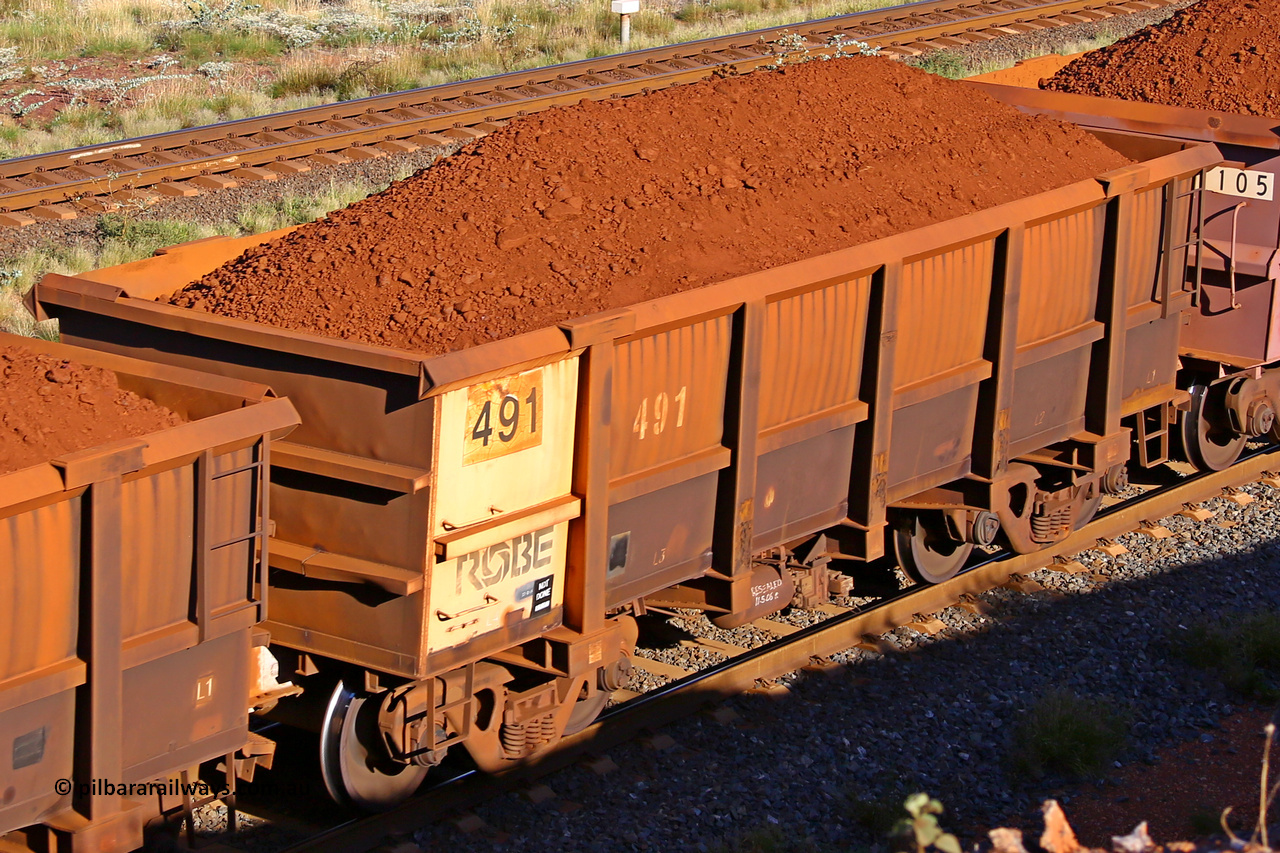 0491 210322 9722
Robe River ore waggon 491, built by Tomlinson Steel WA, rotary coupler end non-handbrake side loaded view at the 17 km on the Cape Lambert line, March 22, 2021.
Keywords: 491;Tomlinson-Steel-WA;Robe-ore-waggon;