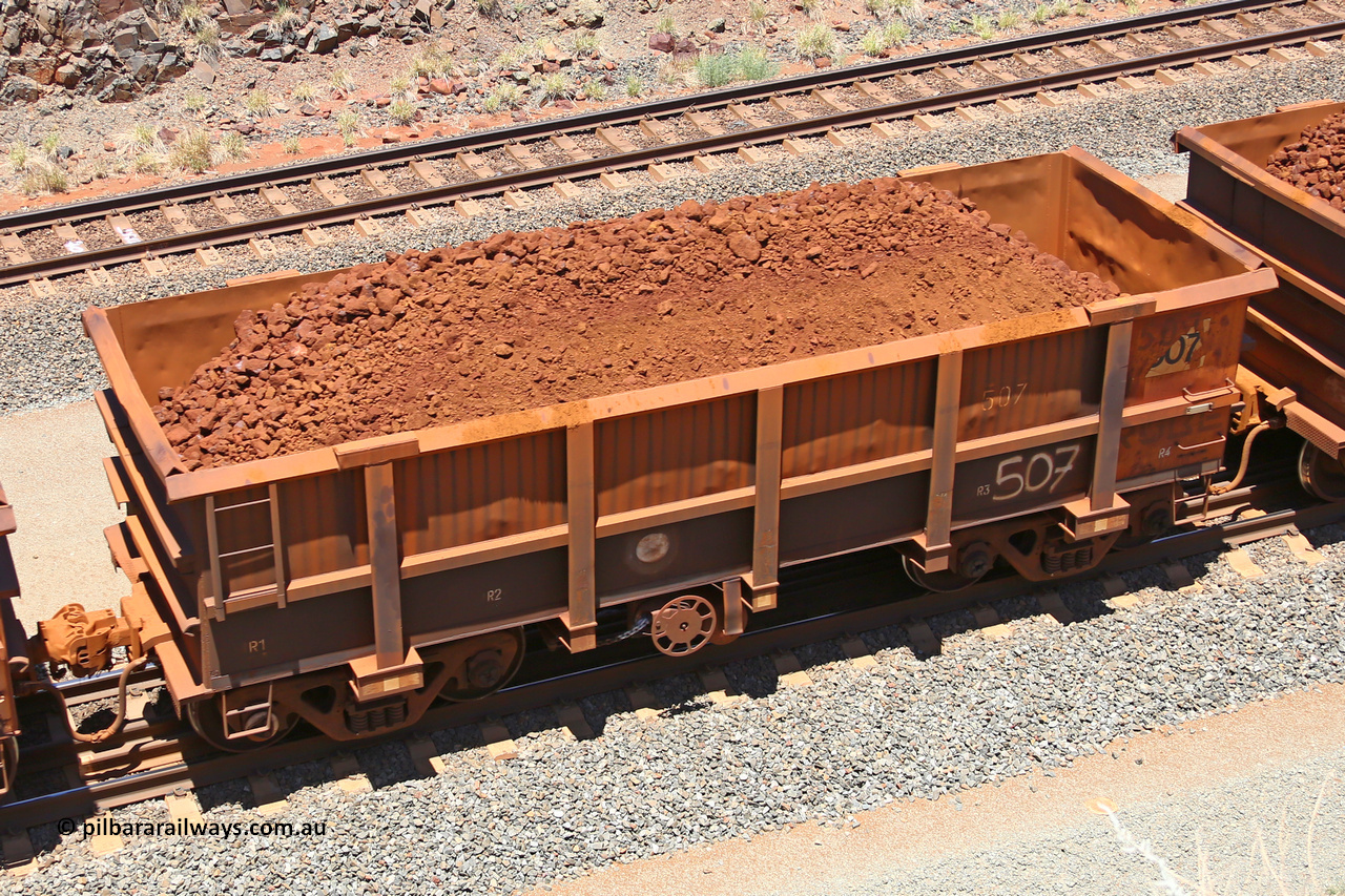 0507 160306 1487
Robe River ore waggon 507, built by Tomlinson Steel WA, fixed coupler handbrake side loaded view, at the 45 km, Harding Siding on the Cape Lambert line. March 6, 2016.
Keywords: 507;Tomlinson-Steel-WA;Robe-ore-waggon;